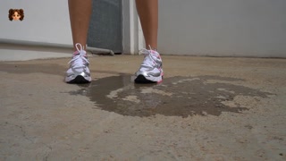 Girl in skirt and red thong pees outside