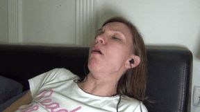 Coughing and searching in the smartphone with headphones (F)