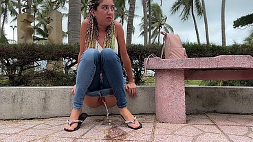 Public Wetting Jeans in Park near the Beach