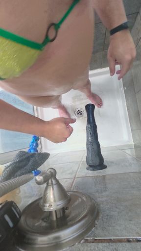 Fucking a 14 inch thick black dildo in the shower in a bikini. Over 2.5 inches wide, destroying my ass