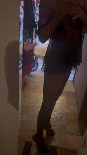 in black babydoll with suspenders for the club visit