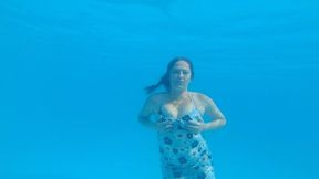 Swimming in Dress in a huge pool and blow bubbles