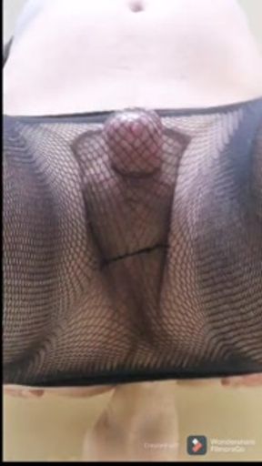 Sissy boy in fishnets fucks dildo
