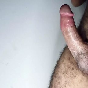 Watch a young man masturbating a big cock