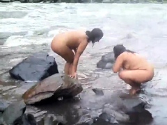 Two indian mature womens  bathing in river naked