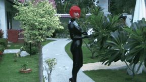 Hot red hair rubber girl in black latex catsuit walk by the pool