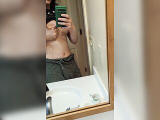sprying a little milk at the mirror