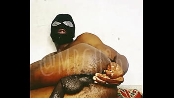 Dirty little African bottom feeding slave spreads and fingers his tight little ass hole and plays with his spit before he bust a big load of cum