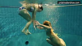 ”Two hot amateurs showing their bodies off under water”