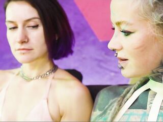 two Shiny Latex Harlots Share Metal Dildo – Anal Training & Gapes