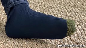 Handsome dude with long hair Nathaniel shows off his feet