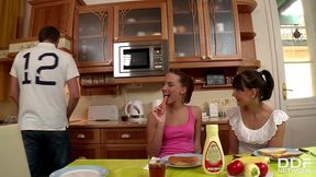naughty coeds demetris and leda suck on man sausage atop the kitchen table