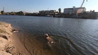 Naked exhibitionist MissMotivated swims in the river