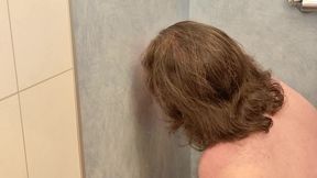 amateur sucks dildo in the shower