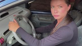 Katiuska in sneakers, learning to start the old car, wheels spinning in place, frustrating pedal pumping.