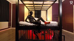 Rubber Nights: the Rubber Slave Rests Tight in a Cage Under the Bed