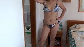 On the beach, my stepmom in a bikini shows me her hairy pussy, ass, and tits.