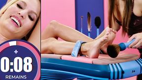 Candee Licious enjoys her feet tickled and laughs while Talia Mint dominates her