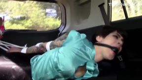 Johannie in spandex hogtied and ballgagged in a car