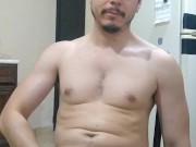 Handsome man flexing and showing off flaccid long cock