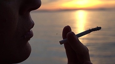 Smoking Cigarettes on the Beach... at day and in Sunset