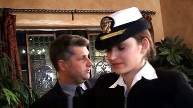 Dani Daniels in leather naval uniform bent over and paddled in lavish living room