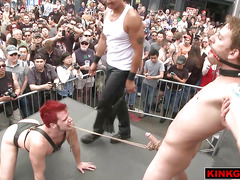 Dude gets his balls crushed in public during a crazy BDSM show!