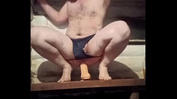 A Russian gay man with the smallest dick in the world rides a huge 12-inch dildo!