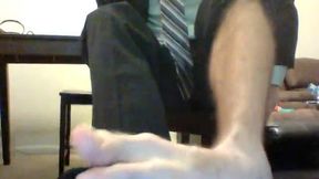 Guy in Suit Showing Off Feet