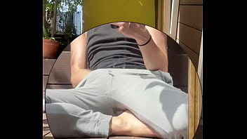 Amateur boy wets his grey sweatpants