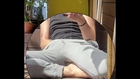 Amateur boy wets his grey sweatpants