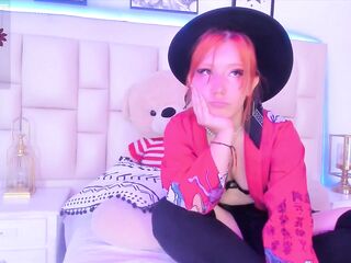 Cute redhead with a cute face shows her tits and twat on web camera show