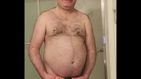 Nude Martin Lavall&eacute_e sodomizes himself with a large dildo in a black cage