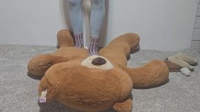 Mickee tramples big stuffy in fuzzy socks