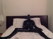 Putting on my shiny latex skin and playing with my rubber cock