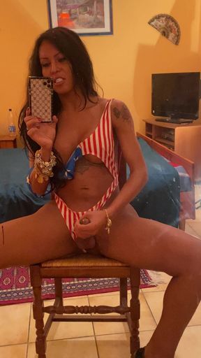 Beautiful Brazilian transexual Luciana Foxx masturbates in front of mirror