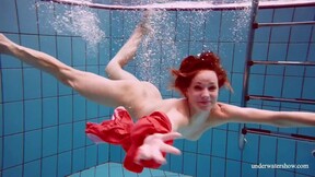 Hot naked twat Avenna swims nude in the pool