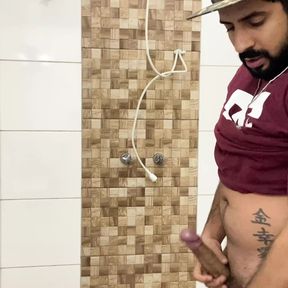 Squirting cum, bearded in a cap alone in the bathroom having fun in the handjob until cumming a lot - Rodrik Dick