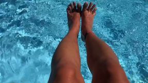 My feet splashing in the pool