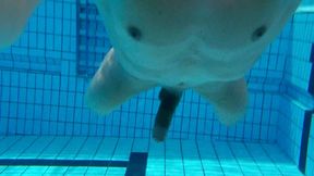 Indoor public pool solo uncut nude fit man swimming