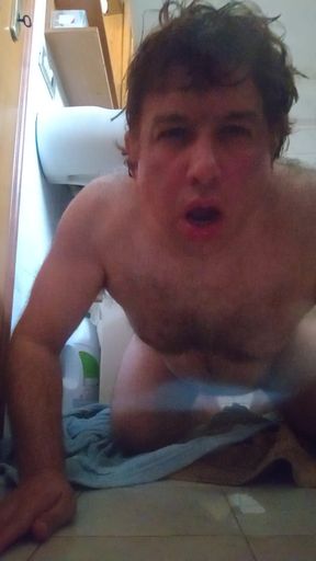 Wet guy after taking a shower masturbates by peeing in the final