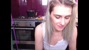 Blonde Typing in Kitchen