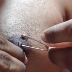 Man piercing  nipple and torture