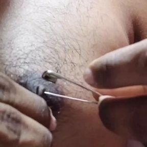 Man piercing  nipple and torture