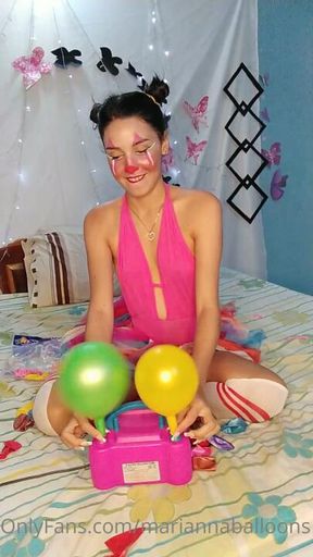 Marianna Clown loves to burst balloons in inflator machine