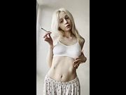 Flat stomach heaving as she blows smoke 🔥