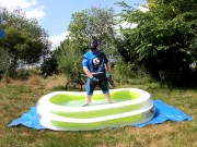 Cyclist pup in pool - cooling down and pawing off