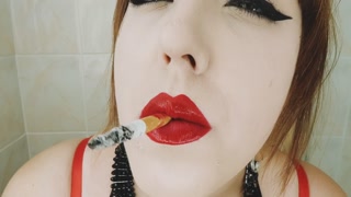 CIGARETTE DANGLING AND SMOKING CLOSE UP WITH RED LIPS
