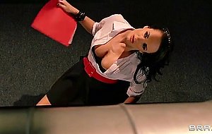 Alektra blue sits on her desk and does striptease