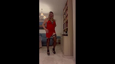 Daniela Monroe TV Spanish transsexual with red dress, heels, lingerie, garter belt masturbates and cums in the living room with abundant cum, anal